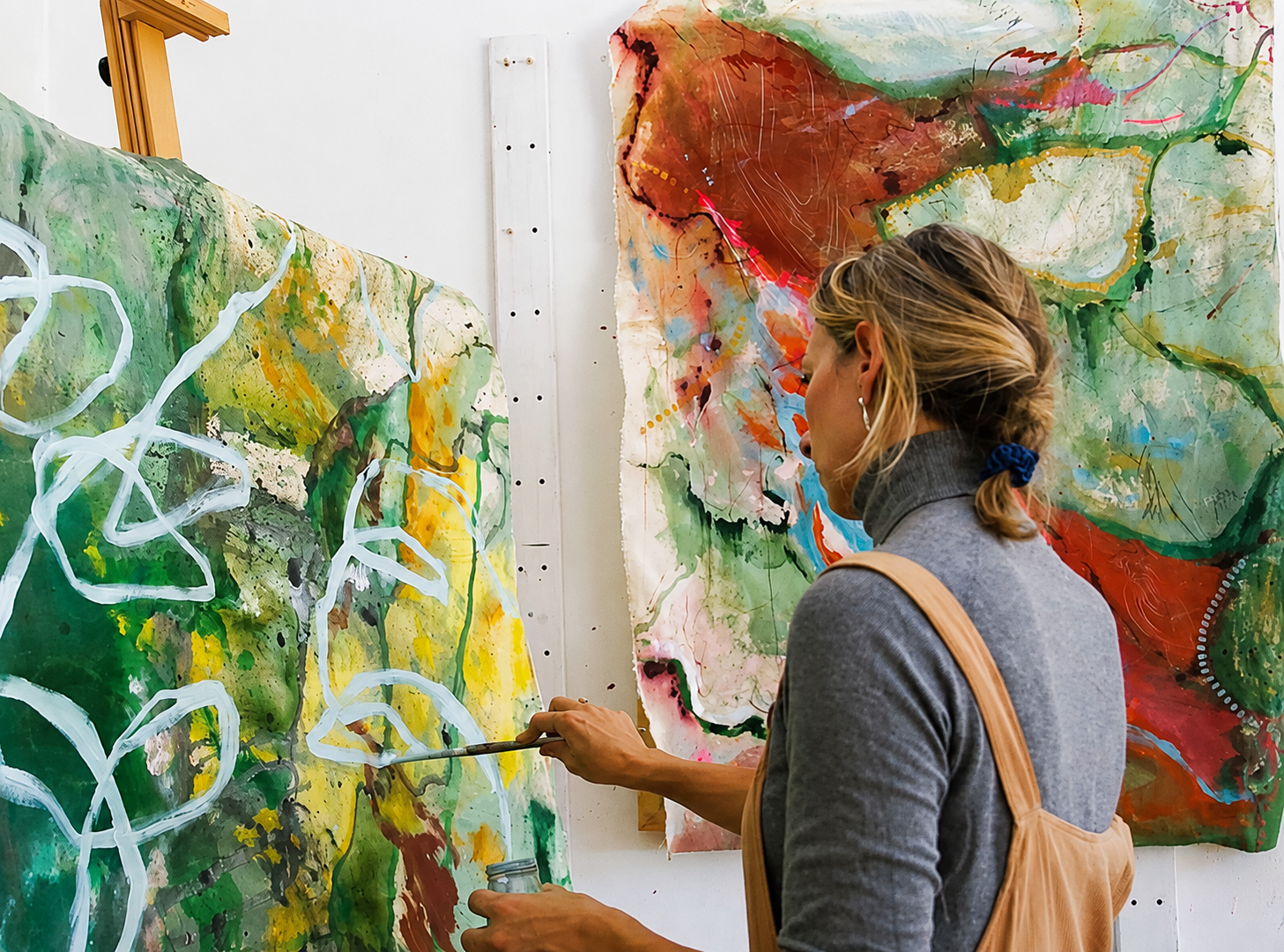 Nicky Myny painting in her studio